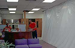 Plastic sheeting lines the access way to offices inside ARRL HQ.